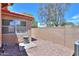 Private backyard with decorative concrete block wall and gravel, providing low maintenance at 1762 N Terrace Cir, Casa Grande, AZ 85122