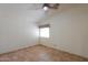 Bedroom featuring tile flooring, a ceiling fan, and a window at 1762 N Terrace Cir, Casa Grande, AZ 85122