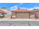 Inviting single-story home featuring a red tile roof and a spacious two-car garage at 1762 N Terrace Cir, Casa Grande, AZ 85122