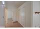 Tile hallway featuring a closet and leading to other rooms, filled with natural light at 1762 N Terrace Cir, Casa Grande, AZ 85122