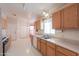 Bright kitchen features stainless steel sink and view of the adjacent dining area at 1762 N Terrace Cir, Casa Grande, AZ 85122