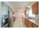 Spacious eat-in kitchen featuring stainless steel appliances and ample countertop space at 1762 N Terrace Cir, Casa Grande, AZ 85122