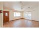 Open concept living room with tile flooring, ceiling fan, vaulted ceiling, and natural light at 1762 N Terrace Cir, Casa Grande, AZ 85122