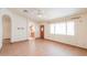 Bright living room features tile flooring, ceiling fan, and access to the kitchen at 1762 N Terrace Cir, Casa Grande, AZ 85122