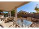 Covered patio area with outdoor seating, perfect for relaxation and entertaining at 17697 W Sunbelt Dr, Surprise, AZ 85374