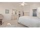 Spacious main bedroom featuring neutral tones, a ceiling fan, and a separate vanity area at 17697 W Sunbelt Dr, Surprise, AZ 85374