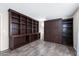 Well-lit room featuring a large built-in bookcase and a Murphy bed at 1846 N Sunview --, Mesa, AZ 85205