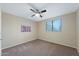 Cozy bedroom with carpet, a ceiling fan, and a window view at 1846 N Sunview --, Mesa, AZ 85205