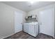 Convenient laundry room with modern washer and dryer and built in shelf with baskets at 1846 N Sunview --, Mesa, AZ 85205