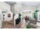 Inviting living room with vaulted ceiling showcases staircase and flows into dining area for entertaining at 1846 N Sunview --, Mesa, AZ 85205