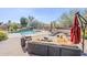 Lush backyard with a sparkling pool, fire pit, and plenty of space for outdoor activities at 19727 E Julius Rd, Queen Creek, AZ 85142