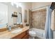 Bathroom featuring a single sink vanity, overhead lighting, and a shower-tub combo at 19727 E Julius Rd, Queen Creek, AZ 85142