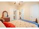 This cozy bedroom includes an ensuite bathroom and a light and airy color palette at 19727 E Julius Rd, Queen Creek, AZ 85142