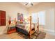 Bedroom with a wooden four-poster bed, soft natural light, and vintage decor at 19727 E Julius Rd, Queen Creek, AZ 85142