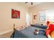 Bedroom featuring two twin beds, a window, and a ceiling fan at 19727 E Julius Rd, Queen Creek, AZ 85142