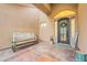 Home entryway featuring covered porch, bench, and decorative door at 19727 E Julius Rd, Queen Creek, AZ 85142