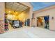 Spacious garage interior offers ample storage, parking for a golf cart, and organizational shelving at 19727 E Julius Rd, Queen Creek, AZ 85142