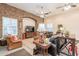 Spacious living room with brick accent wall and comfortable leather furniture at 19727 E Julius Rd, Queen Creek, AZ 85142