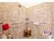 Shower stall featuring tiled walls, overhead shower head, and a built-in bench at 19727 E Julius Rd, Queen Creek, AZ 85142