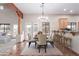 Charming dining area featuring a wooden table, seating for six, and bright natural light at 19927 W Meadowbrook Ave, Litchfield Park, AZ 85340