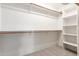 Large walk-in closet with ample shelving and rod space for organized storage at 19927 W Meadowbrook Ave, Litchfield Park, AZ 85340