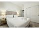 Cozy bedroom with neutral tones, soft carpet, and side tables with lamps at 20477 N 91St Dr, Peoria, AZ 85382