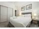 Bedroom features a cozy bed, soft lighting, and ample closet space for storage at 20477 N 91St Dr, Peoria, AZ 85382