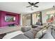 Inviting living area featuring a sectional sofa, television, and modern decor at 20477 N 91St Dr, Peoria, AZ 85382