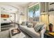 Open-concept living room flows into the main bedroom, creating a spacious and inviting atmosphere at 20477 N 91St Dr, Peoria, AZ 85382
