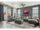 Spacious living area with sectional sofa and sliding glass doors at 20477 N 91St Dr, Peoria, AZ 85382