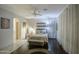 Cozy main bedroom featuring a ceiling fan, ensuite and decorative art work at 20477 N 91St Dr, Peoria, AZ 85382