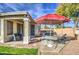 Outdoor entertaining area featuring a backyard pool, patio, lounge chairs, and manicured landscaping at 20477 N 91St Dr, Peoria, AZ 85382