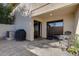 Backyard patio with outdoor seating, sliding glass doors, textured stucco, and a grill with a cover at 2142 E Turney Ave # 4, Phoenix, AZ 85016