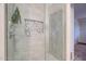 Walk-in shower showcasing decorative tiles, glass door, and shower head at 2142 E Turney Ave # 4, Phoenix, AZ 85016