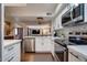 Open-concept kitchen featuring stainless appliances and white quartz counters at 2142 E Turney Ave # 4, Phoenix, AZ 85016