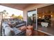 Inviting balcony with stylish furniture and a view into a spacious living room, great for indoor-outdoor living at 2201 N Central Ave # 2A, Phoenix, AZ 85004