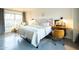 Bright bedroom featuring a patterned headboard, modern desk, and a large window with city views at 2201 N Central Ave # 2A, Phoenix, AZ 85004