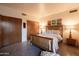 Bright bedroom featuring a wood bed frame, side tables with lamps, and ample closet space at 2201 N Central Ave # 2A, Phoenix, AZ 85004