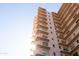 Low angle view of a modern high-rise with large balconies against a bright sky at 2201 N Central Ave # 2A, Phoenix, AZ 85004