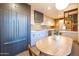 Kitchen featuring modern cabinetry, an eat-in kitchen table, and stainless steel appliances at 2201 N Central Ave # 2A, Phoenix, AZ 85004