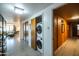 Hallway features in-unit laundry stacked behind sliding doors for convenience at 2201 N Central Ave # 2A, Phoenix, AZ 85004