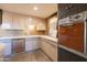 Modern kitchen with sleek cabinetry, unique backsplash, and stainless steel appliances at 2201 N Central Ave # 2A, Phoenix, AZ 85004