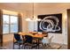 Bright dining room featuring a modern chandelier, stylish furnishings, and natural light at 2201 N Central Ave # 2A, Phoenix, AZ 85004