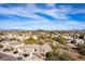 Scenic aerial view of desert homes with vibrant blue sky and distant mountains provides a serene neighborhood setting at 22905 N 19Th Way, Phoenix, AZ 85024