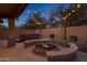 Tranquil backyard features a hot tub, fire pit, and string lights, ideal for outdoor relaxation and entertaining at 22905 N 19Th Way, Phoenix, AZ 85024