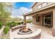 Cozy backyard with a fire pit and landscaping under string lights at 22905 N 19Th Way, Phoenix, AZ 85024