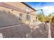 Backyard showcasing a swing set in a low-maintenance gravel area, perfect for outdoor fun at 22905 N 19Th Way, Phoenix, AZ 85024