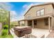 Serene backyard with a covered patio, outdoor lighting, and relaxing hot tub at 22905 N 19Th Way, Phoenix, AZ 85024