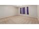 Empty bedroom with neutral walls, carpet flooring and window with dark curtains at 22905 N 19Th Way, Phoenix, AZ 85024
