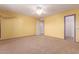 Bright bedroom featuring yellow walls, carpet, a ceiling fan, and a walk-in closet at 22905 N 19Th Way, Phoenix, AZ 85024